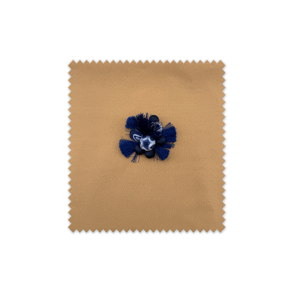 accesorio decorativo azul con borlas para manualidades