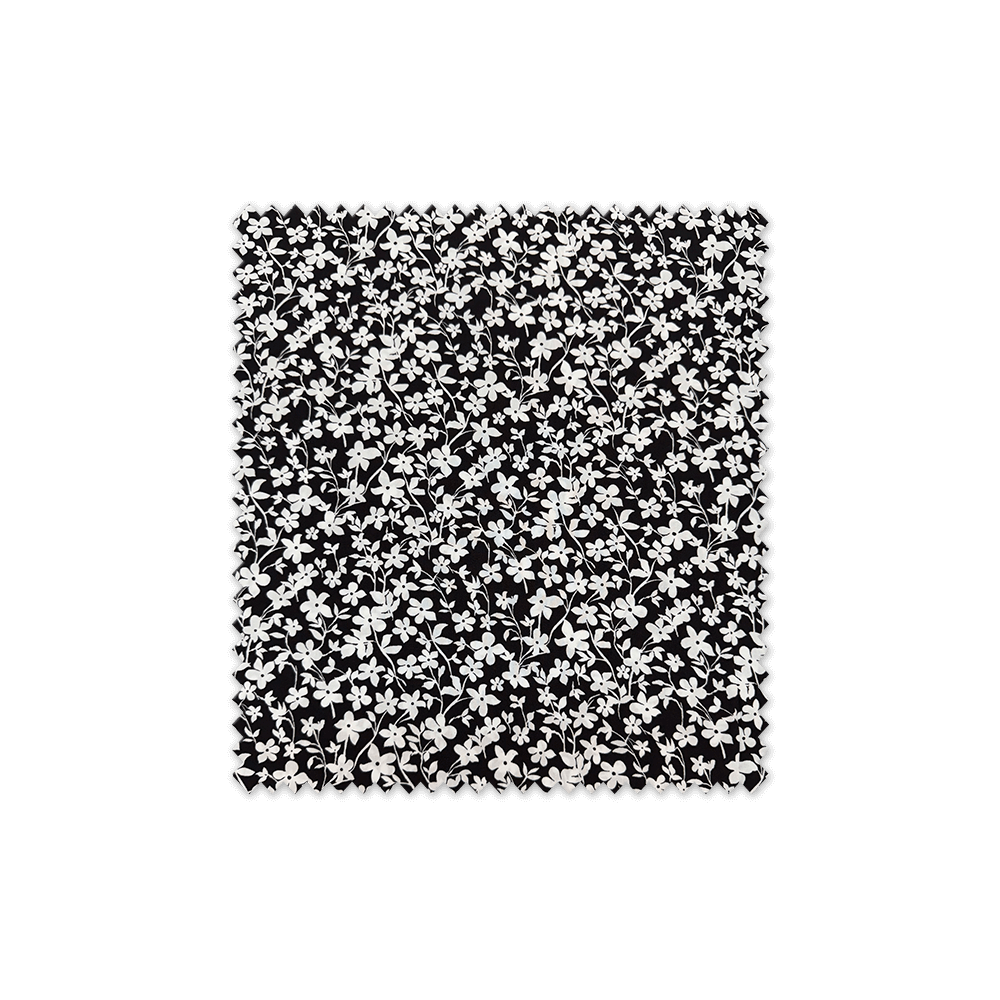 tela viscosa flores blancas fondo negro moda