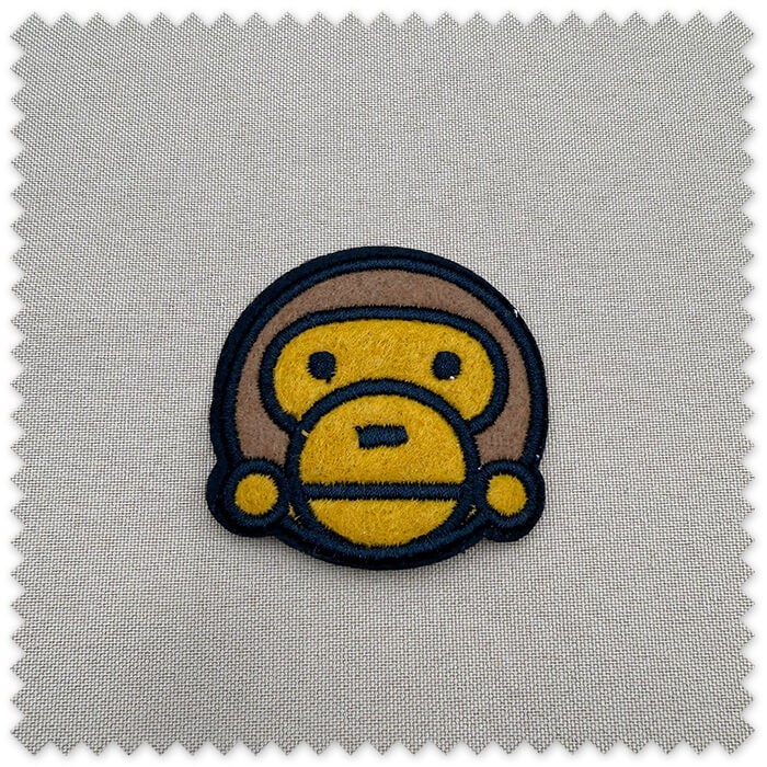 Parche mono para coser decorativo