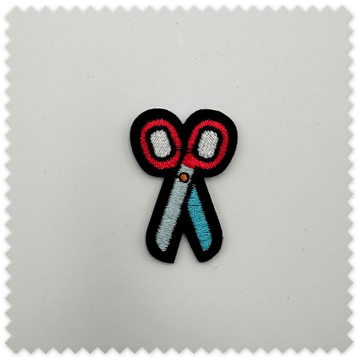 parche tijeras costura
parche textil tela planchar coser