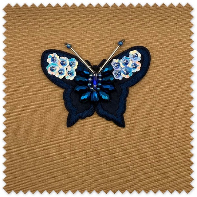 Parche decorativo mariposa para coser
Aplicación textil mariposa azul elegante