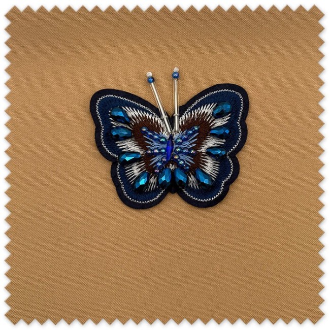 Parche mariposa azul redonda con lentejuelas