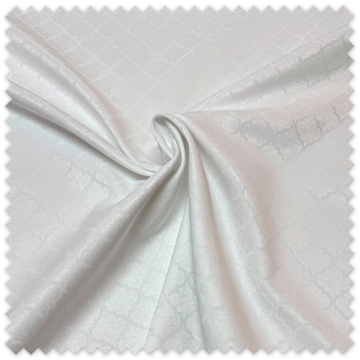 Tejido blanco para manteles con motivo árabe decorativo