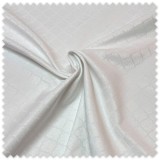 Tejido blanco para manteles con motivo árabe decorativo