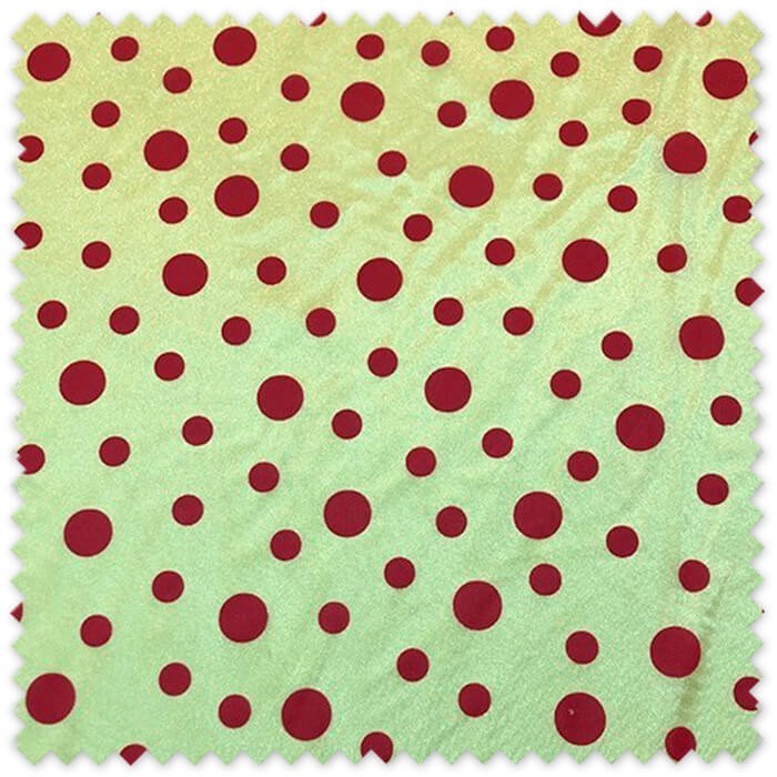 Tela rasete amarilla con lunares rojos, ideal para disfraces de Carnaval, vestuario festivo, decoración y manualidades.