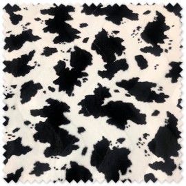 Tela Animal Print Vaca de terciopelo estampado para disfraces, vestuario de espectáculos, decoración y costura creativa.