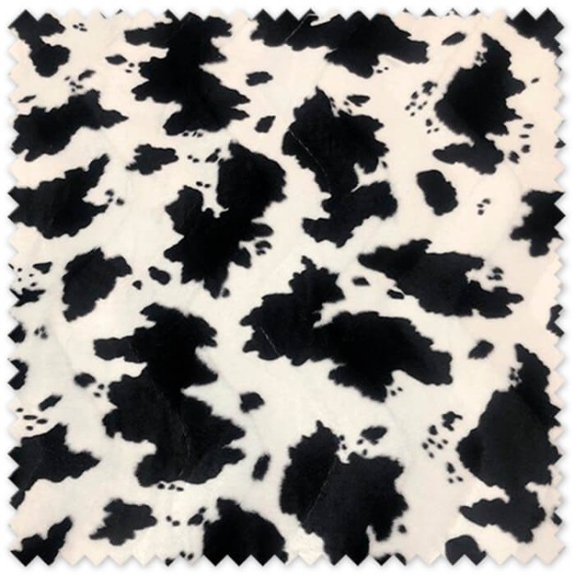 Tela Animal Print Vaca de terciopelo estampado para disfraces, vestuario de espectáculos, decoración y costura creativa.